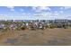 A picturesque aerial view showcases a charming home nestled near the ocean, surrounded by wetlands and cityscape at 4616 Eyerly St., North Myrtle Beach, SC 29582