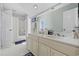 Bright bathroom with double vanity and mirror, tiled walls and bath with shower at 4616 Eyerly St., North Myrtle Beach, SC 29582