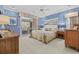 Comfortable bedroom with a large bed, sliding doors, and stylish wooden furniture at 4616 Eyerly St., North Myrtle Beach, SC 29582