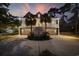 Exterior elevation of home featuring a staircase, garage and a fountain at 4616 Eyerly St., North Myrtle Beach, SC 29582