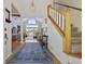 Spacious foyer with hardwood floors, staircase, and a view into the living room at 4616 Eyerly St., North Myrtle Beach, SC 29582