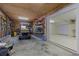 Spacious garage with storage shelves, a golf cart, and access to a bright, finished room at 4616 Eyerly St., North Myrtle Beach, SC 29582