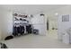 Garage with storage cabinets and multiple storage shelves, with entry to main house at 4616 Eyerly St., North Myrtle Beach, SC 29582