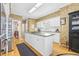 Bright kitchen with white cabinetry, stainless steel appliances, and ample counter space at 4616 Eyerly St., North Myrtle Beach, SC 29582