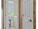 Functional laundry room with a window, washer and dryer, and storage shelves for supplies at 4616 Eyerly St., North Myrtle Beach, SC 29582