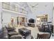 Bright living room featuring a vaulted ceiling, open floor plan, and a view of the kitchen and dining area at 4616 Eyerly St., North Myrtle Beach, SC 29582