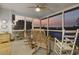 Relaxing screened porch with rocking chairs, providing a tranquil view of the sunset over the marsh at 4616 Eyerly St., North Myrtle Beach, SC 29582