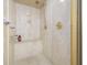 Modern shower with a built-in bench, gold fixtures, and a sleek design at 4616 Eyerly St., North Myrtle Beach, SC 29582