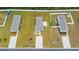 Birds eye view of three similar homes, showcasing lawn sizes, landscaping, driveways and privacy fences at 478 Samara Dr., Longs, SC 29568