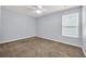 Standard bedroom featuring plush neutral carpeting and a ceiling fan at 478 Samara Dr., Longs, SC 29568