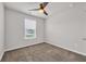 Bedroom with plush carpeting, a ceiling fan, and a window bringing in natural light at 478 Samara Dr., Longs, SC 29568
