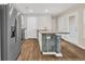 Bright kitchen with stainless steel refrigerator, central island, and wood-look flooring at 478 Samara Dr., Longs, SC 29568
