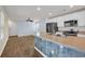 Updated kitchen with white cabinets, a central island, and stainless steel appliances at 478 Samara Dr., Longs, SC 29568