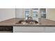 Close up of a stainless steel double sink and laminate countertops at 478 Samara Dr., Longs, SC 29568