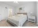 Bedroom with coastal decor, ceiling fan, and a glimpse of the adjacent bathroom at 4887 Luster Leaf Circle # 105, Myrtle Beach, SC 29577