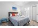 Bedroom with a queen bed, complemented by neutral wall color and an en-suite bathroom, offering convenience and privacy at 4887 Luster Leaf Circle # 105, Myrtle Beach, SC 29577