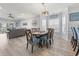 Open-concept dining room with wood floors and a view of the living room at 4887 Luster Leaf Circle # 105, Myrtle Beach, SC 29577