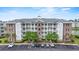Stunning condominium building with ample parking and beautiful landscaping at 4887 Luster Leaf Circle # 105, Myrtle Beach, SC 29577