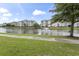 Complex with a pond, fountain feature and lush surroundings, creating a serene living environment at 4887 Luster Leaf Circle # 105, Myrtle Beach, SC 29577