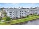 Multi-story apartment building complex offering scenic lake views and modern amenities at 4887 Luster Leaf Circle # 105, Myrtle Beach, SC 29577