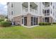 Apartment building with a screened in porch area and an inviting outdoor space at 4887 Luster Leaf Circle # 105, Myrtle Beach, SC 29577