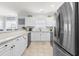 Bright kitchen with white cabinets, stainless steel appliances and granite countertops at 4887 Luster Leaf Circle # 105, Myrtle Beach, SC 29577