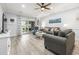 Comfortable living room with a ceiling fan, decor, and sliding glass doors to the patio at 4887 Luster Leaf Circle # 105, Myrtle Beach, SC 29577