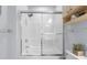 Bright white shower with a sliding glass door and neutral paint at 4887 Luster Leaf Circle # 105, Myrtle Beach, SC 29577