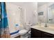 Functional bathroom with a shower, toilet, and vanity sink with a tropical curtain detail at 4925 Pond Shoals Ct. # 202, Myrtle Beach, SC 29579