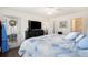 Spacious bedroom featuring a walk-out, large TV and closet with an en-suite bathroom at 4925 Pond Shoals Ct. # 202, Myrtle Beach, SC 29579
