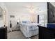 Comfortable bedroom with a queen bed with a white headboard, white bedding and light blue accents at 4925 Pond Shoals Ct. # 202, Myrtle Beach, SC 29579
