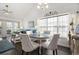 Cozy dining area with vaulted ceiling, natural light, and adjacent living room at 4925 Pond Shoals Ct. # 202, Myrtle Beach, SC 29579