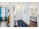 Bright hallway featuring hardwood floors, nautical decor, and access to the bedroom at 4925 Pond Shoals Ct. # 202, Myrtle Beach, SC 29579