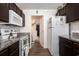 Functional kitchen featuring dark cabinets, a full-size refrigerator, and microwave at 4925 Pond Shoals Ct. # 202, Myrtle Beach, SC 29579