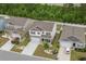 Aerial view showcasing the property's location within a well-kept neighborhood with manicured lawns and paved driveways at 5068 Wavering Place Loop, Myrtle Beach, SC 29579