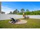 Backyard with Adirondack chairs, a fire pit, and a playground set at 5068 Wavering Place Loop, Myrtle Beach, SC 29579