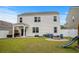 Large backyard features a fire pit, seating, and play area at 5068 Wavering Place Loop, Myrtle Beach, SC 29579