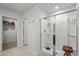 Bathroom featuring a glass door walk-in shower with tile flooring and walls at 5068 Wavering Place Loop, Myrtle Beach, SC 29579
