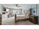 Relaxing bedroom features a large bed, a window for natural light, and an adjacent desk for a workspace at 5068 Wavering Place Loop, Myrtle Beach, SC 29579