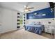 Nautical-themed bedroom features blue accents, oars on the wall, and a ceiling fan at 5068 Wavering Place Loop, Myrtle Beach, SC 29579