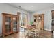 Dining area with natural light, hardwood floors, and view of the backyard patio at 5068 Wavering Place Loop, Myrtle Beach, SC 29579