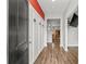 Inviting entryway with coat hooks and hardwood floors leads into a spacious living area, creating a warm welcome at 5068 Wavering Place Loop, Myrtle Beach, SC 29579