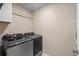 Laundry room features gray Samsung washer and dryer units at 5068 Wavering Place Loop, Myrtle Beach, SC 29579