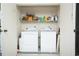Convenient laundry room featuring a washer and dryer, storage shelves, and organized space for laundry essentials at 510 Fairwood Lakes Dr. # 17-P, Myrtle Beach, SC 29588