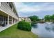 View of the building's outdoor living space with a tranquil pond, fountain, and gazebo at 510 Fairwood Lakes Dr. # 17-P, Myrtle Beach, SC 29588