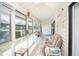 Inviting sunroom with ample natural light, cozy seating, and serene views, perfect for relaxation and leisure at 510 Fairwood Lakes Dr. # 17-P, Myrtle Beach, SC 29588