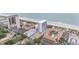 Aerial view of a building near the beach showcasing pools, parking lots, and scenic surroundings at 5511 North Ocean Blvd. # 806, Myrtle Beach, SC 29577