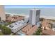 Aerial view of beachfront condos and a hotel showcasing beach access and ocean views at 5511 North Ocean Blvd. # 806, Myrtle Beach, SC 29577