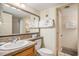 Bathroom featuring a large mirror, towels and a shower view through the doorway at 5511 North Ocean Blvd. # 806, Myrtle Beach, SC 29577