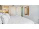 A bedroom provides access to the bathroom and closet and features a neutral color palette at 5511 North Ocean Blvd. # 806, Myrtle Beach, SC 29577